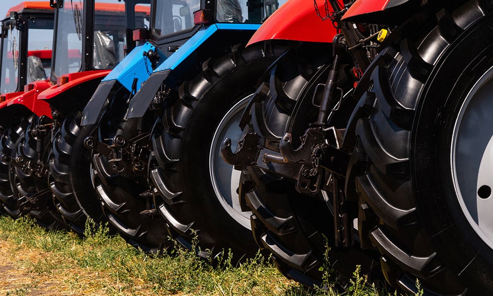 Close up of Tractor tires for a fleet of trackers on a field
